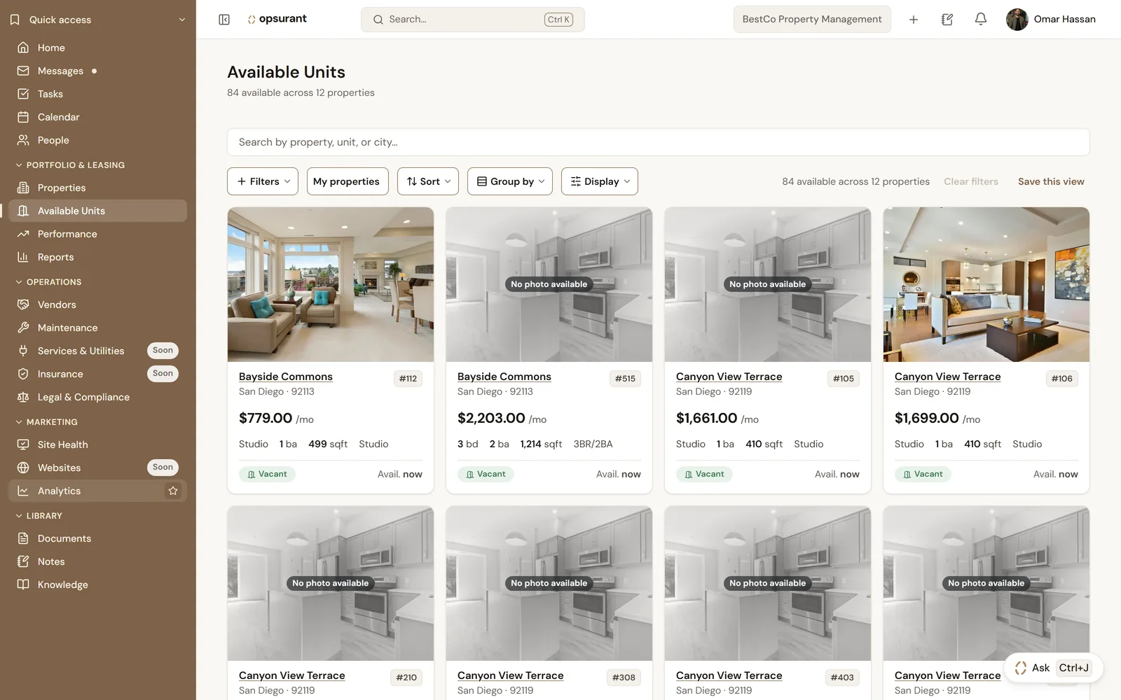 Screenshot of the Available Units page: vacant units shown as cards with rent, bedrooms, bathrooms, square footage and availability date, filterable and groupable.